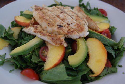 Spinach salad with long island peaches, avocado, cherry tomatoes and white balsamic dressing